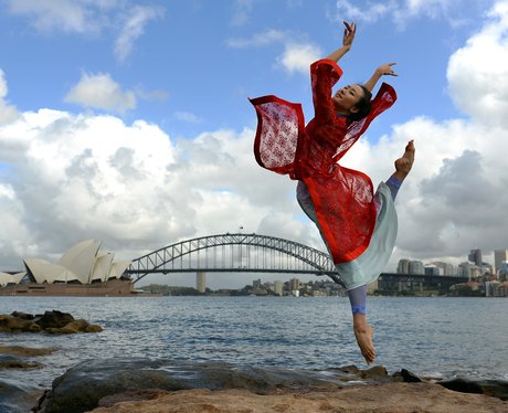 A woman dancing in Sydney harbour