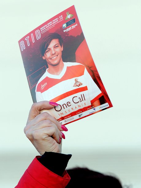 Louis Tomlinson on the cover of a matchday program