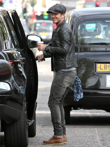 David Beckham in a leather jacket and Baker's boy hat. 