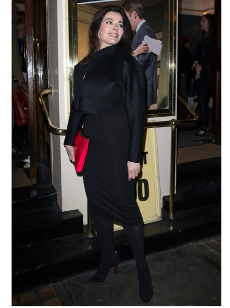 Nigella Lawson with a neon pink clutch bag