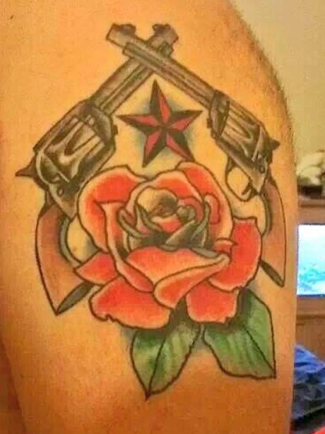 A tattoo of Guns And Roses logo