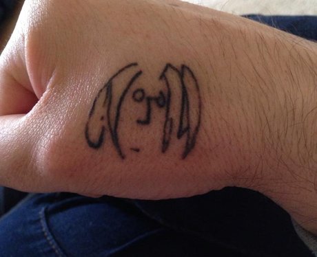 A tattoo of John Lennon