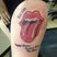 Image 6: A tattoo of The Rolling Stones logo