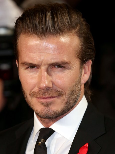 David Beckham wears a red ribbon