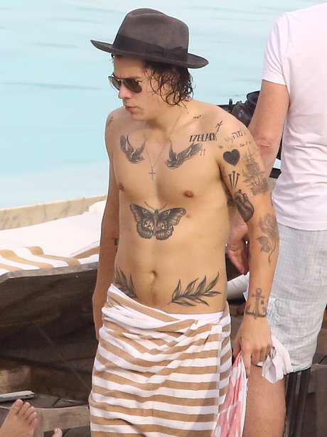 Harry Styles shows off new tattoos