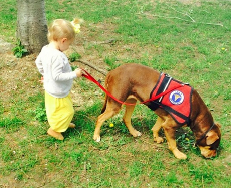 Vivian Lake Brady walking a dog