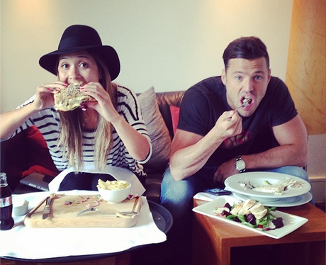 Myleene Klass and Mark Wright get stuck into some grub, 'Man Vs Food ...