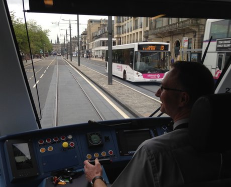 A tram travels along Edinburgh's Princes Street