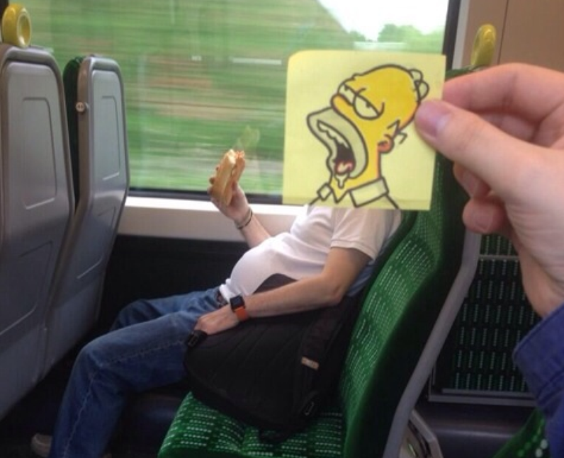 A person eating on a train