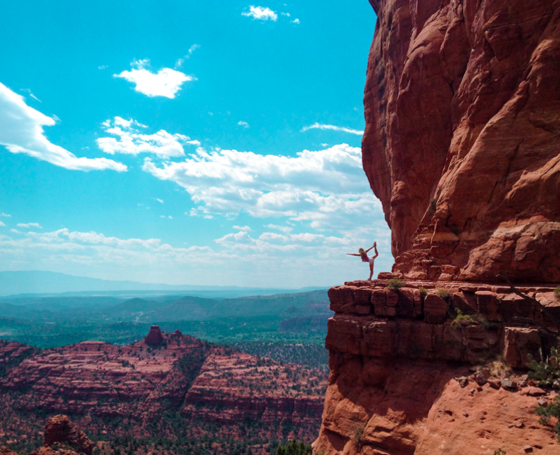 A person doing yoga on top of Cathedral Rock