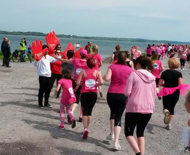 Ladies in pink running.