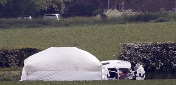 Forensic teams at the scene of crash