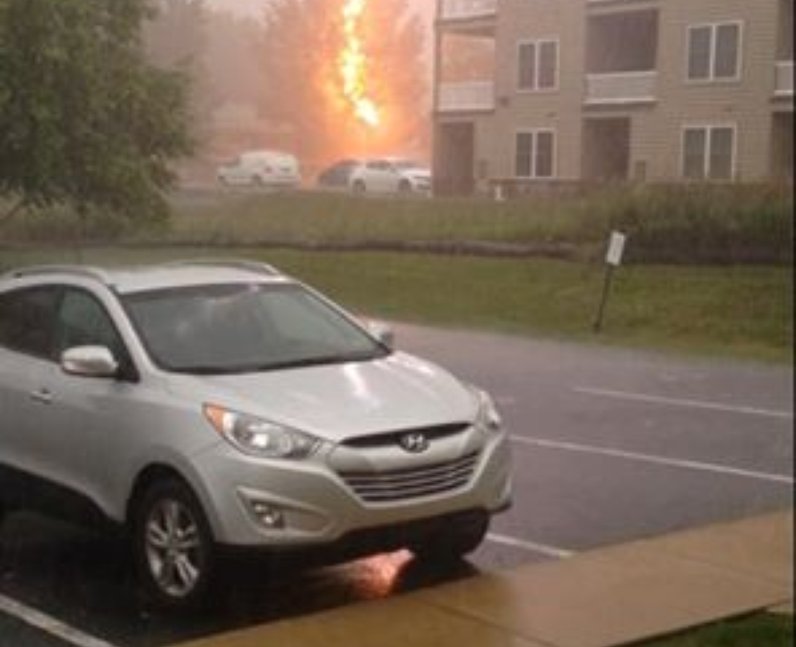 Lightening hitting a car during a storm