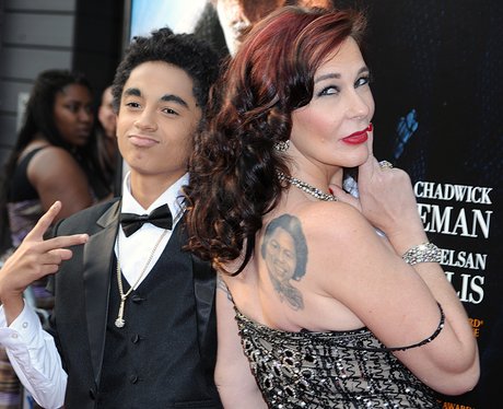 Tomi Rae Brown with her son and tattoo