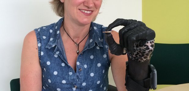 Corinne shows off her bionic hand