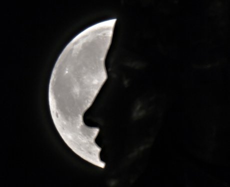 A person in front of the Supermoon