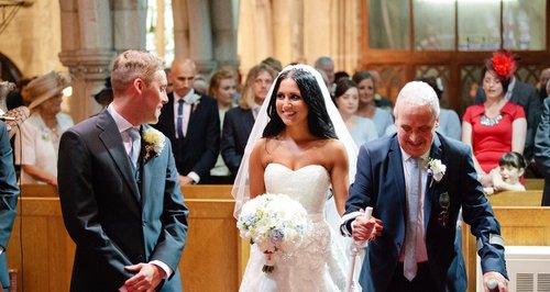 Phil Lawrence walking his daughter down the aisle.