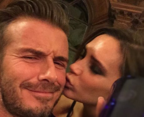 Victoria and David Beckham kiss