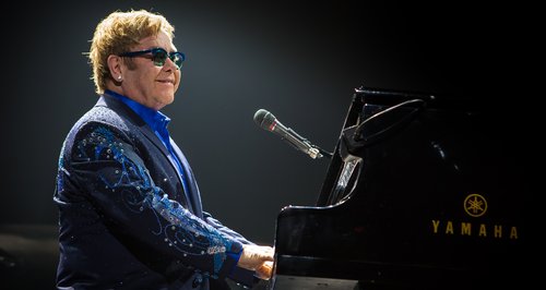 Elton John at his piano