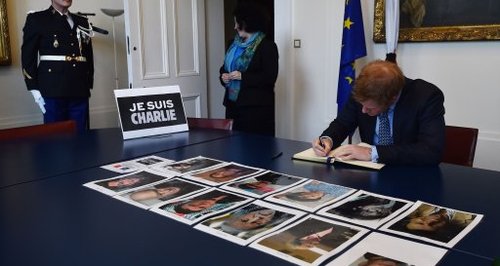 Prince Harry signs condolence book