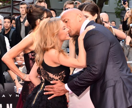 Kylie Minogue and Dwayne Johnson kiss