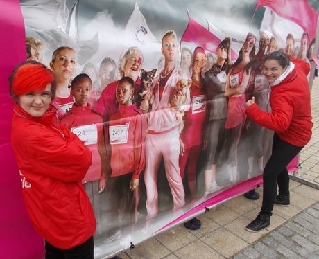 Heart Angels posing by a poster