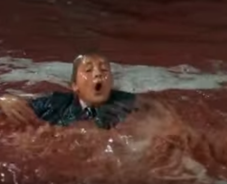 Augustus Glop in a chocolate river