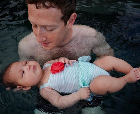 Mark Zuckerberg with his child