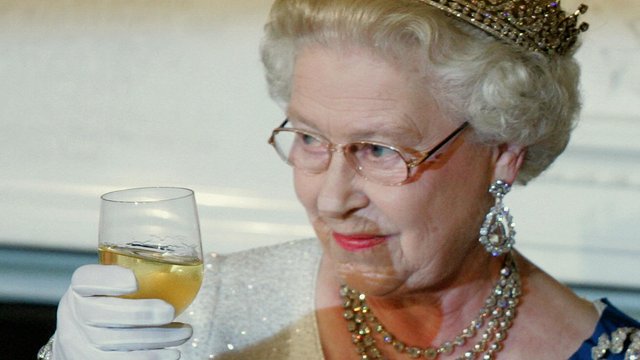 The Queen Elizabeth  drinking making a toast 