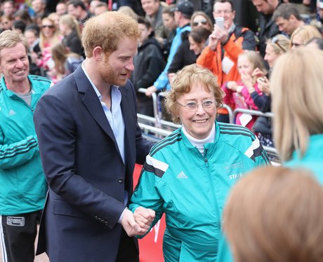 Prince Harry helps Sylvia Disley when she trips