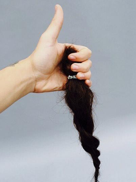 Harry Styles ponytail chop