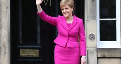 Nicola Sturgeon waves from the steps of Bute House