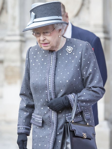 Queen Elizabeth II in a a grey spotty coat
