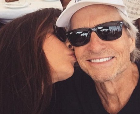 Catherine Zeta-Jones kisses Michael Douglas