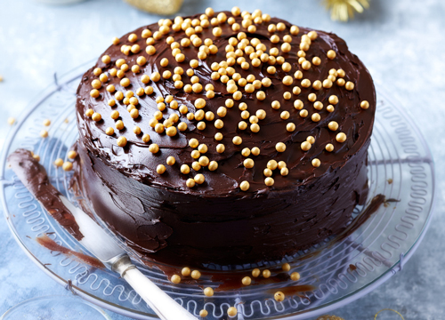 Chocolate cake with gold ball decorations