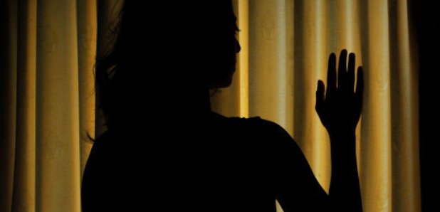 woman silhouette abuse slavery