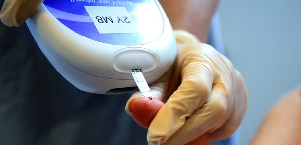 Nurse giving a patient a diabetes test