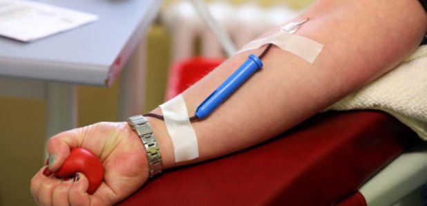 Person giving blood.