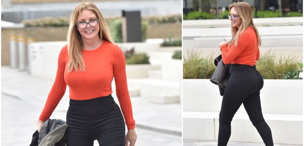 Carol Vorderman shows off her curves in VERY tight jeans in London