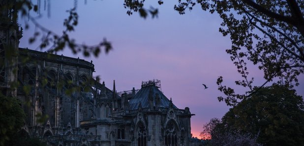 Notre Dame cathedral is seen on sunrise after the 
