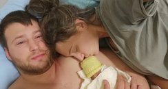 Baby Hope-Rose cuddling her parents