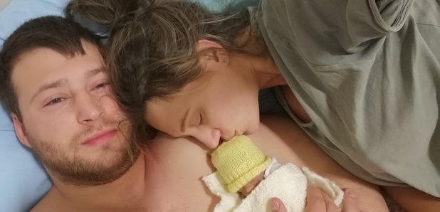 Baby Hope-Rose cuddling her parents
