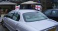 Image 8: England flags on car in Bedford